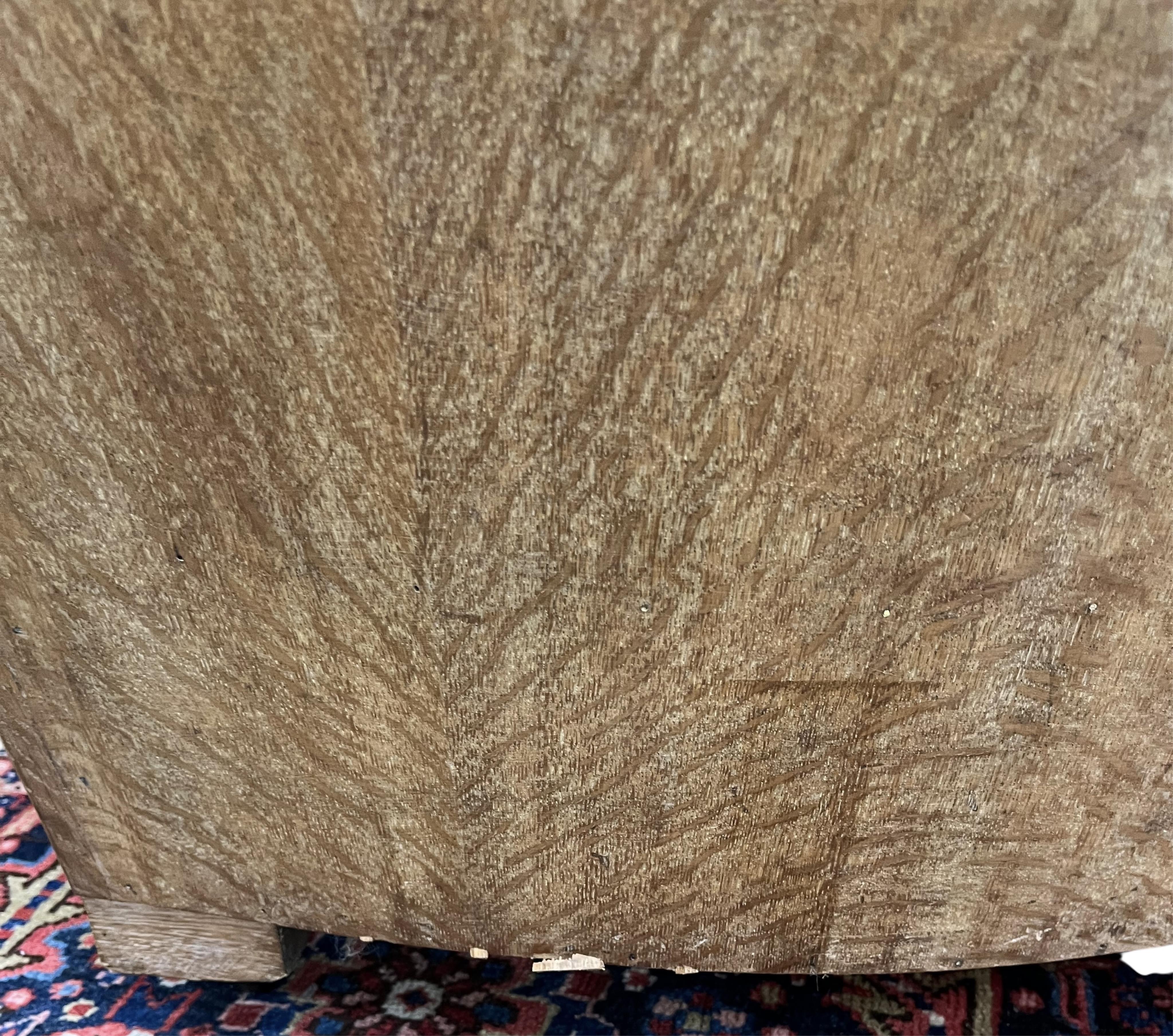 A pair of French Art Deco oak armchairs, width 69cm, depth 90cm, height 69cm